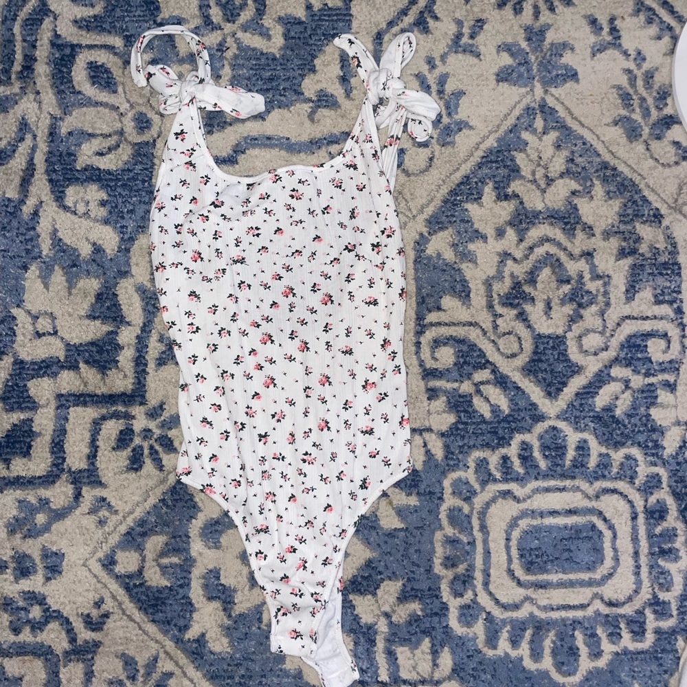 Cute and comfy bodysuit with low back. Could definitely dress up or down!